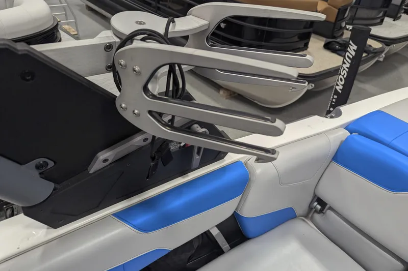 Slide: The Image of 2022 Malibu Wakesetter 22 LSV interior with blue and white seating, wakeboard rack. - 31