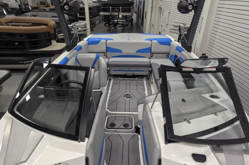 Slide: The Image of 2022 Malibu Wakesetter 22 LSV interior with blue and gray seating, open windshield. - 36