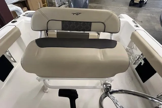 Slide: The Image of 2021 Tidewater 220 CC Adventure boat seat with beige and black upholstery. - 4