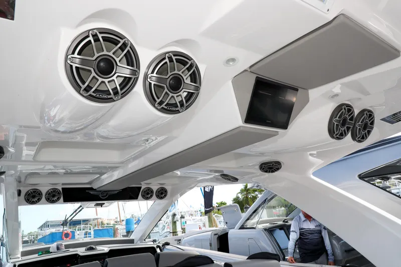 Slide: The Image of Luxury 2026 Deep Impact 449 Sport boat cruising near city skyline. - 13