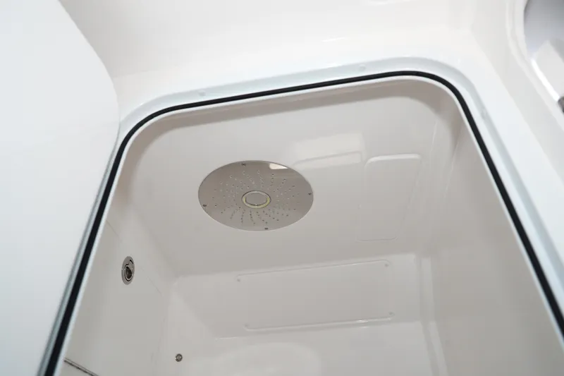 Slide: The Image of Modern interior of 2026 Deep Impact 449 Sport boat with sleek seating and compact kitchenette. - 16