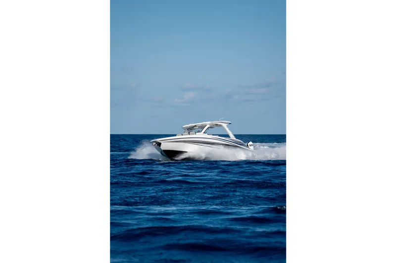 Slide: The Image of Interior of 2026 Deep Impact 449 Sport boat with sleek seating and storage compartments. - 39