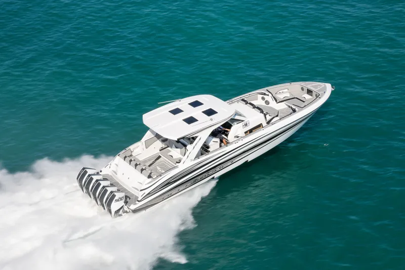 Slide: The Image of 2026 Deep Impact 449 Sport boat cruising on open water, showcasing sleek design and powerful engines. - 4