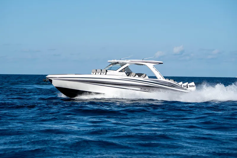 Slide: The Image of Interior view of 2026 Deep Impact 449 Sport boat with open storage compartment. - 41