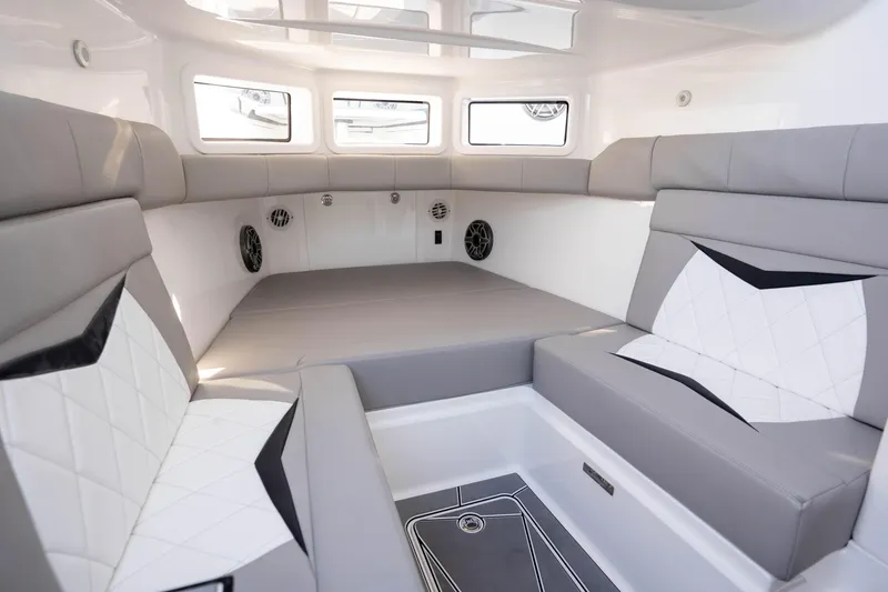 Slide: The Image of Luxurious 2026 Deep Impact 449 Sport boat interior with seating and table, ocean view. - 54