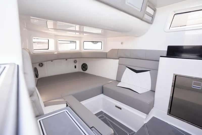 Slide: The Image of Luxury seating on 2026 Deep Impact 449 Sport boat, featuring sleek design and ocean backdrop. - 55