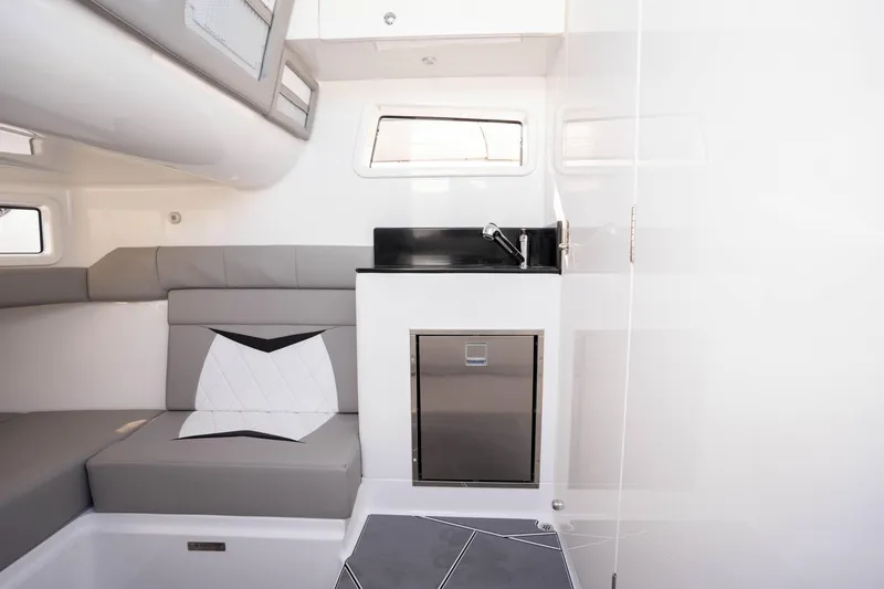 Slide: The Image of 2026 Deep Impact 449 Sport boat interior with JL Audio speakers and sleek design. - 56