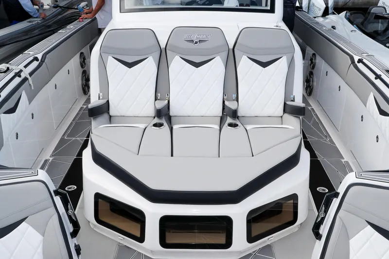 Slide: The Image of 2026 Deep Impact 449 Sport boat cruising on blue ocean waters. - 9