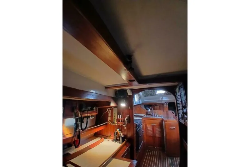 Slide: The Image of Interior of 1980 Hardin 45 sailboat with wooden cabinetry and nautical equipment. - 22