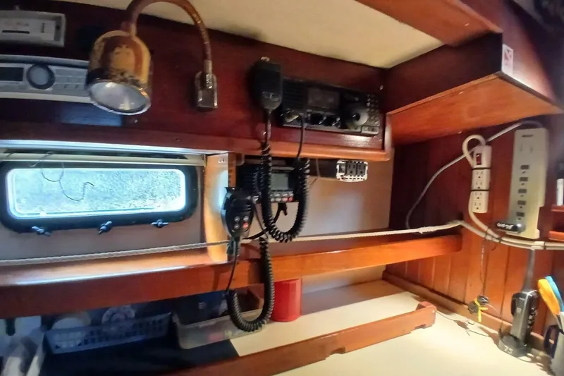 Slide: The Image of Interior of a 1980 Hardin 45 sailboat with radio equipment and wooden cabinetry. - 26