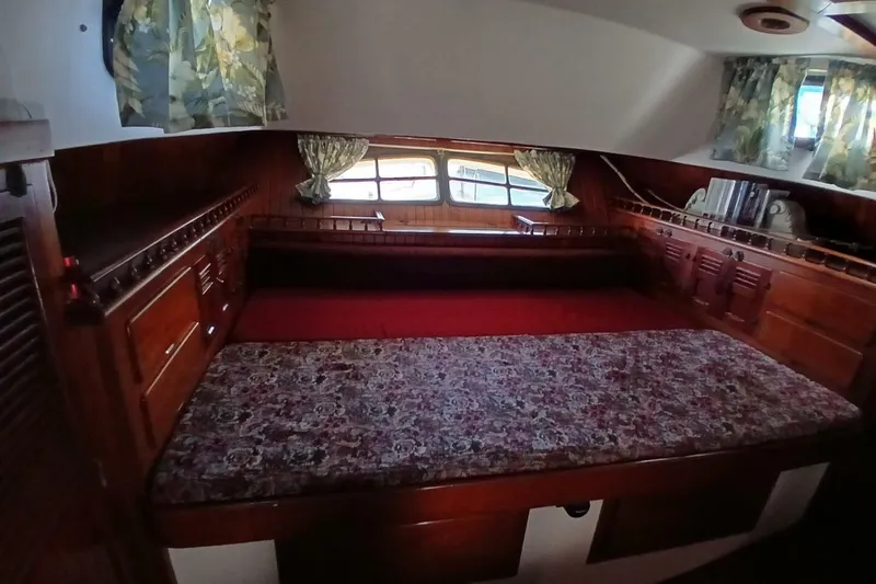 Slide: The Image of Cozy 1980 Hardin 45 yacht cabin with floral cushions and wooden interior. - 28