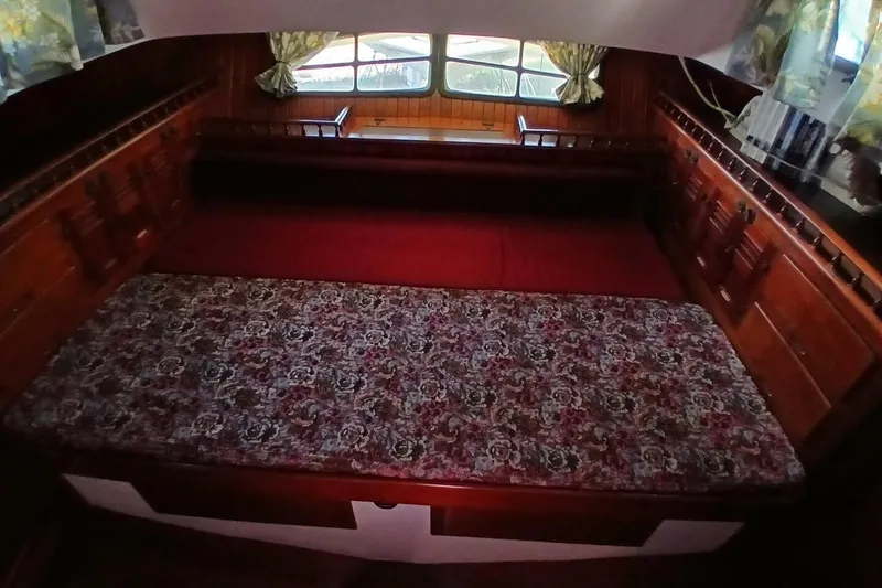 Slide: The Image of Cozy cabin interior of 1980 Hardin 45 sailboat with floral bedding and wooden furnishings. - 29