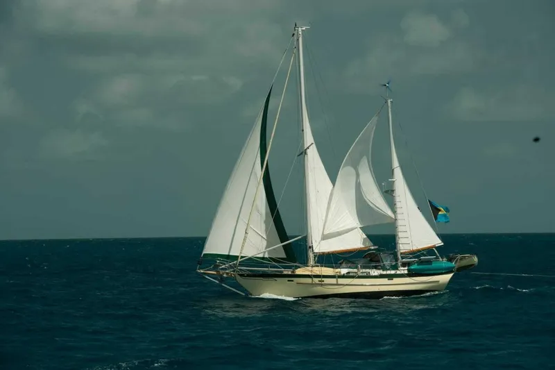 Slide: The Image of 1980 Hardin 45 sailboat navigating open sea under cloudy skies. - 3