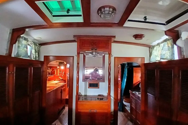 Slide: The Image of Interior of 1980 Hardin 45 sailboat with wooden cabinetry and nautical decor. - 30