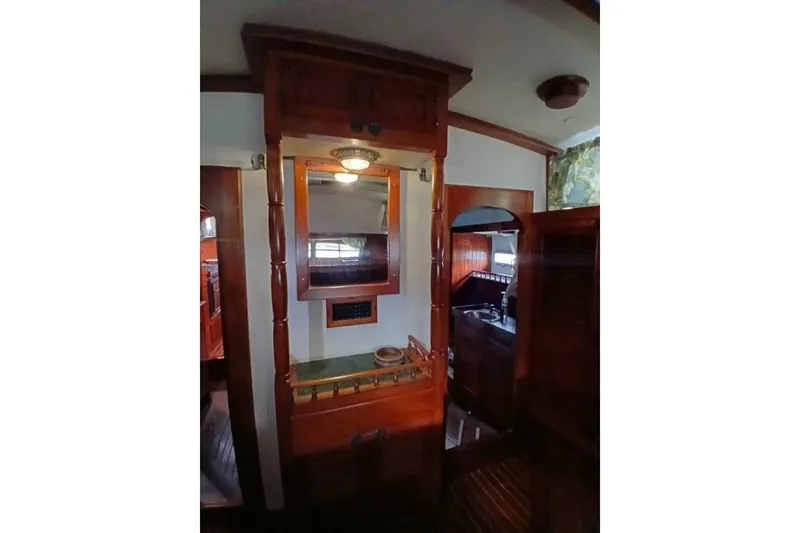 Slide: The Image of Interior of 1980 Hardin 45 yacht featuring wooden cabinetry and mirror. - 34