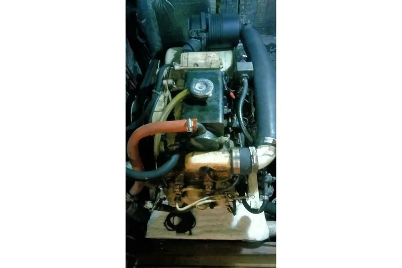 Slide: The Image of 1980 Hardin 45 engine with hoses and components in a compact setup. - 59