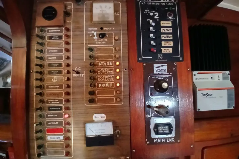Slide: The Image of Electrical control panel on a 1980 Hardin 45 boat, featuring various switches and indicators. - 62