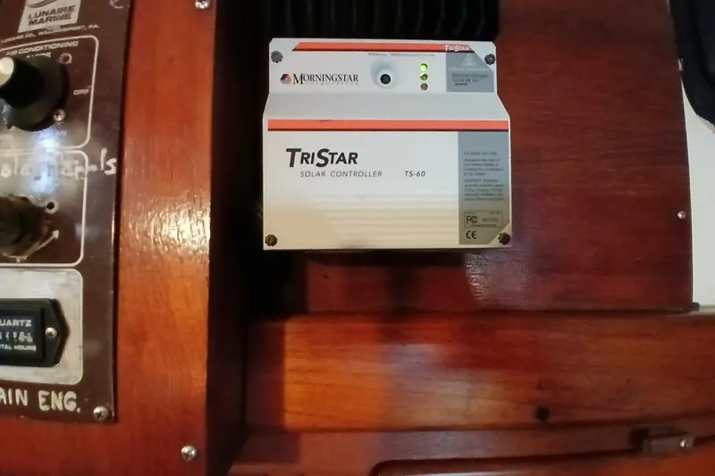 Slide: The Image of TriStar TS-60 solar controller on 1980 Hardin 45 yacht's wooden panel. - 64