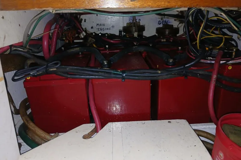 Slide: The Image of Battery compartment of a 1980 Hardin 45 boat with red batteries and wiring. - 68