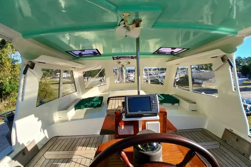 Slide: The Image of Interior view of 1980 Hardin 45 sailboat cockpit with navigation equipment. - 7