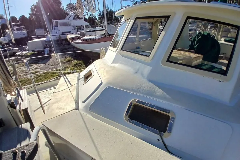 Slide: The Image of 1980 Hardin 45 sailboat deck and cabin in a sunny boatyard. - 77