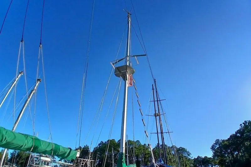 Slide: The Image of Sailboat masts against clear blue sky, Hardin 45 model, 1980. - 80