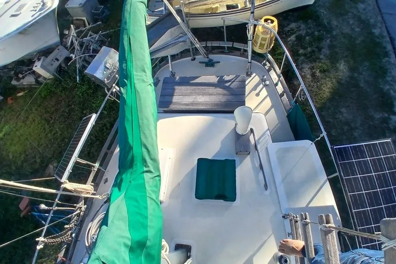 Slide: The Image of Overhead view of 1980 Hardin 45 sailboat deck with green sail cover and solar panels. - 81