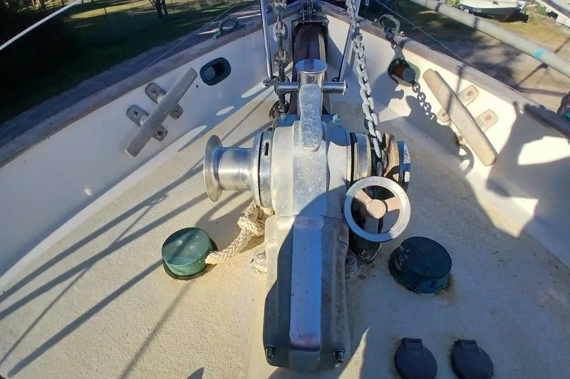 Slide: The Image of Deck view of a 1980 Hardin 45 sailboat featuring anchor windlass and chain. - 82