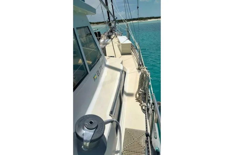 Slide: The Image of 1980 Hardin 45 sailboat deck with clear blue water in the background. - 86