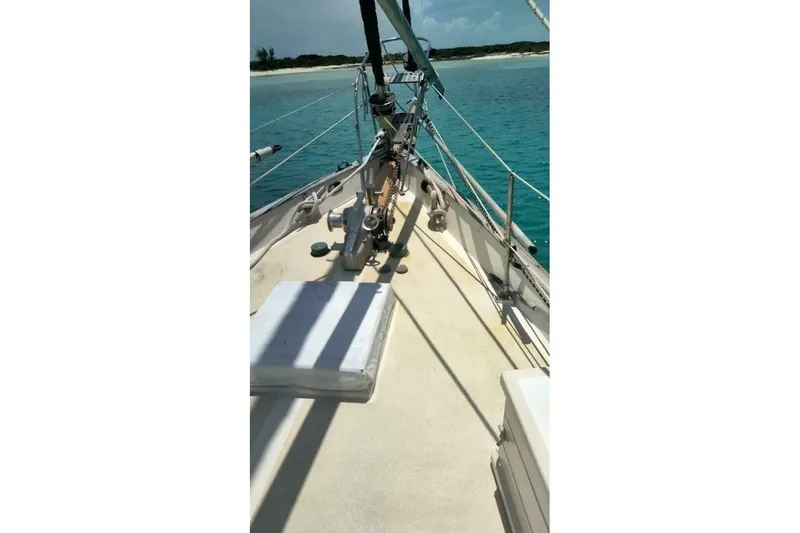 Slide: The Image of Deck view of 1980 Hardin 45 sailboat on clear turquoise water. - 87