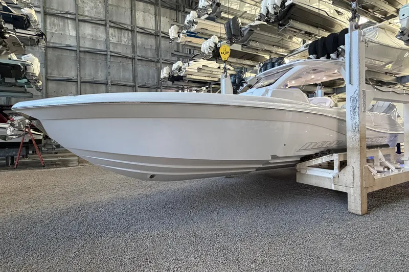 The Image of 2025 Deep Impact 369 Sport boat in storage, showcasing sleek design and modern features. - 0