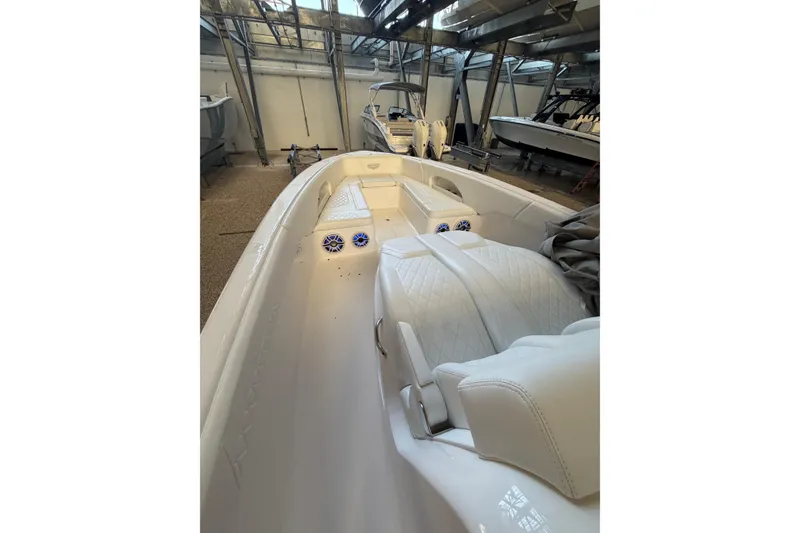 Slide: The Image of 2025 Deep Impact 369 Sport boat interior with white seating and modern design. - 19