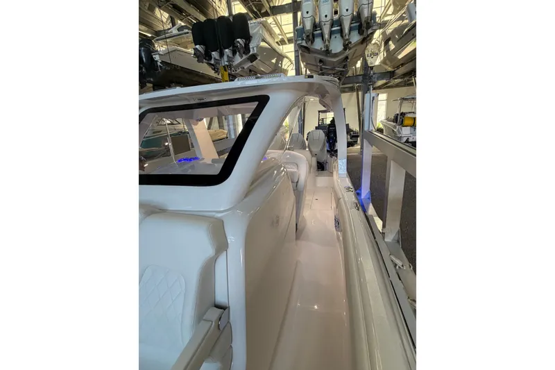 Slide: The Image of 2025 Deep Impact 369 Sport boat interior with sleek white seating and modern design. - 20