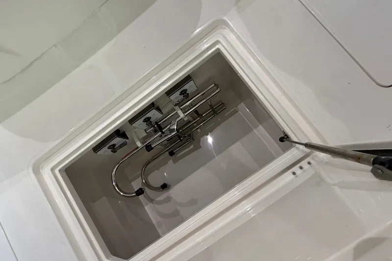 Slide: The Image of Open compartment on 2025 Deep Impact 369 Sport boat, showing interior fittings. - 27