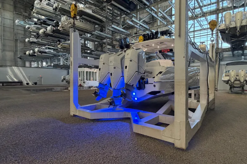 Slide: The Image of 2025 Deep Impact 369 Sport boat in storage facility with blue lighting. - 30