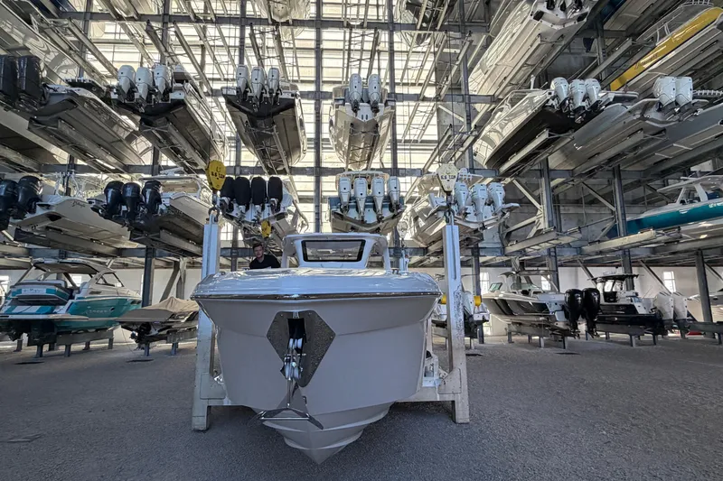 Slide: The Image of 2025 Deep Impact 369 Sport boat in a large indoor storage facility. - 34