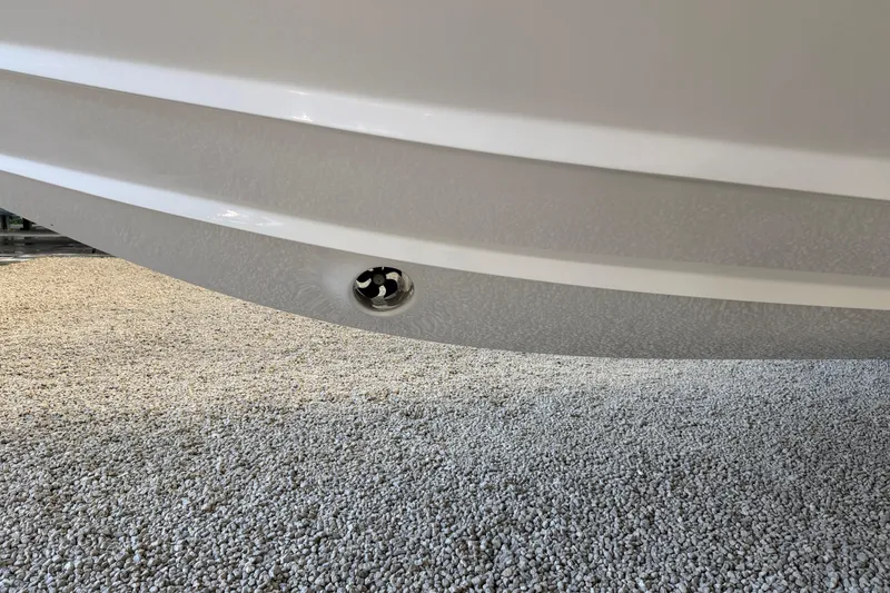 Slide: The Image of 2025 Deep Impact 369 Sport boat hull detail on gravel surface. - 37
