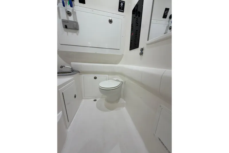 Slide: The Image of 2025 Deep Impact 369 Sport boat bathroom with modern fixtures and white interior design. - 9
