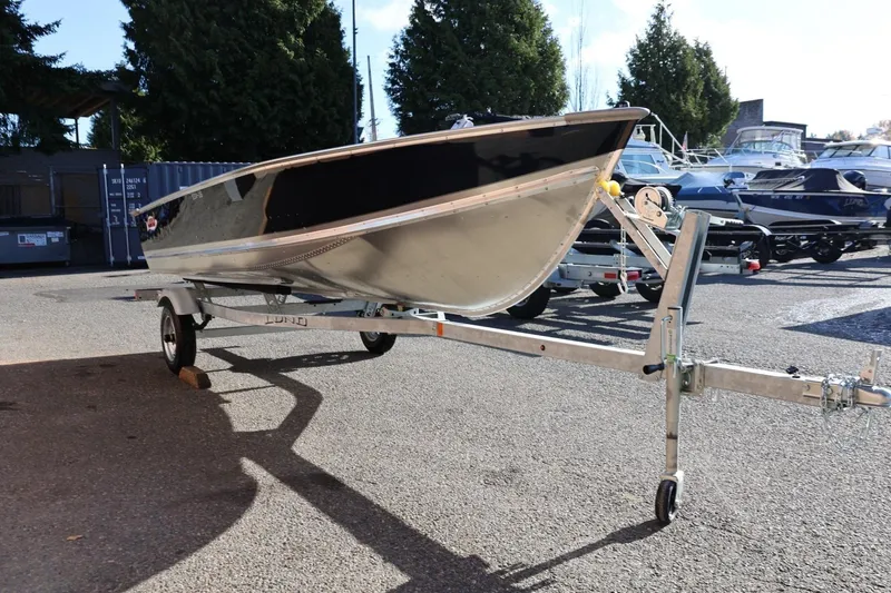Slide: The Image of 2026 Lund SSV-16 Tiller boat on trailer in outdoor setting. - 10