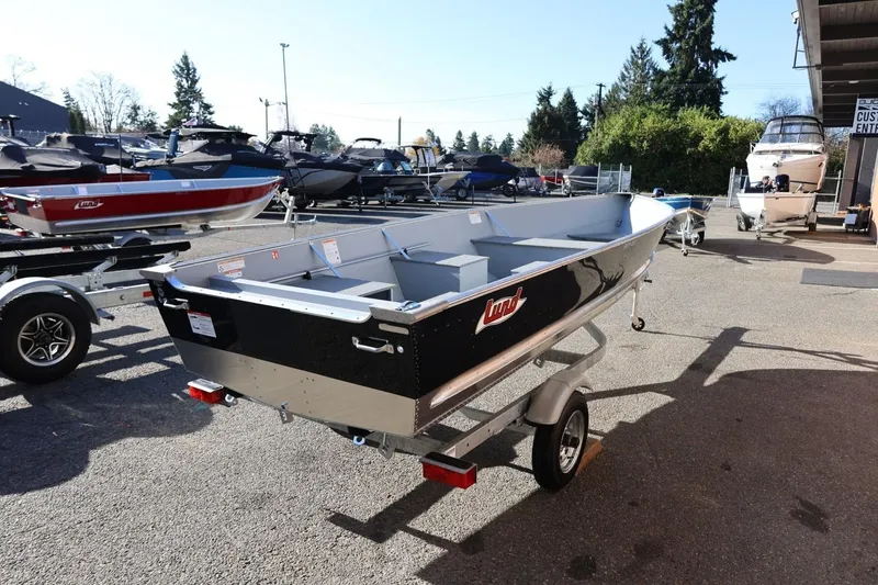 Slide: The Image of 2026 Lund SSV-16 Tiller boat on trailer in outdoor showroom. - 7