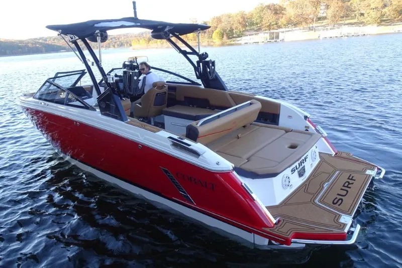 Slide: The Image of 2026 Cobalt R8 Surf boat on a lake, featuring a sleek red design. - 10