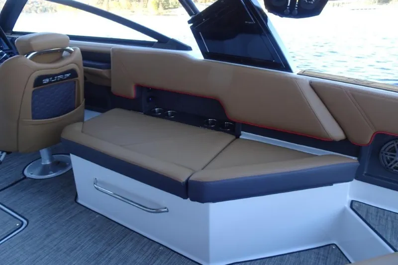 Slide: The Image of 2026 Cobalt R8 Surf boat interior with tan seating and modern design. - 14