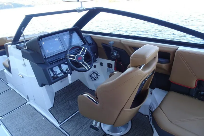 Slide: The Image of 2026 Cobalt R8 Surf boat cockpit with modern controls and brown seating. - 18