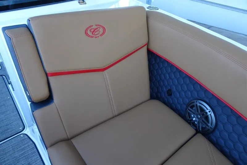 Slide: The Image of Luxurious seating in 2026 Cobalt R8 Surf boat with tan upholstery and red accents. - 24