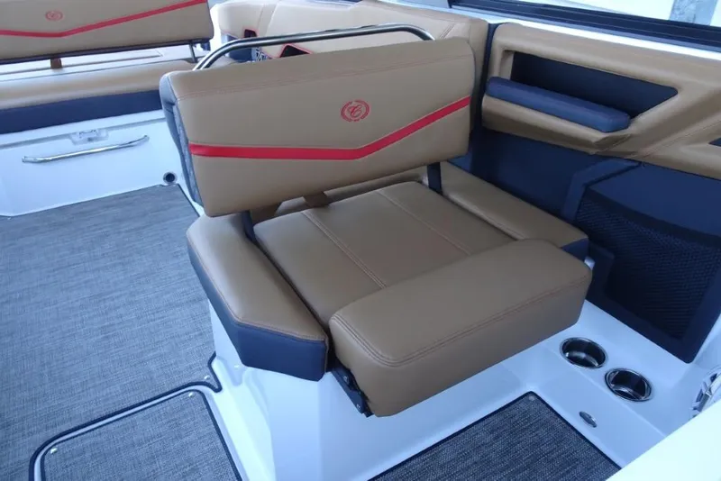 Slide: The Image of 2026 Cobalt R8 Surf boat interior with tan and red seating, modern design. - 26
