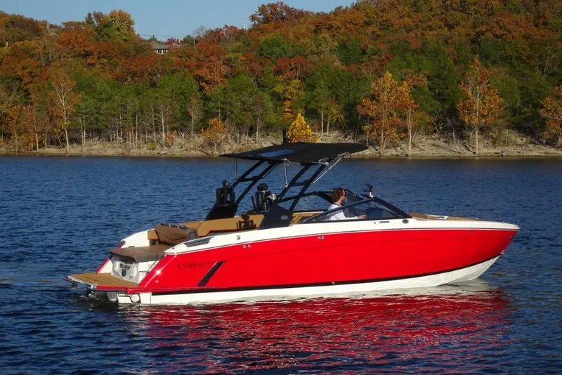 Slide: The Image of 2026 Cobalt R8 Surf boat on a lake with autumn trees in the background. - 3