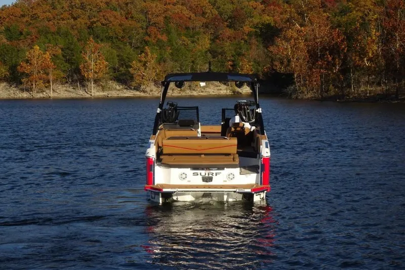 Slide: The Image of 2026 Cobalt R8 Surf boat on a lake with autumn trees in the background. - 5