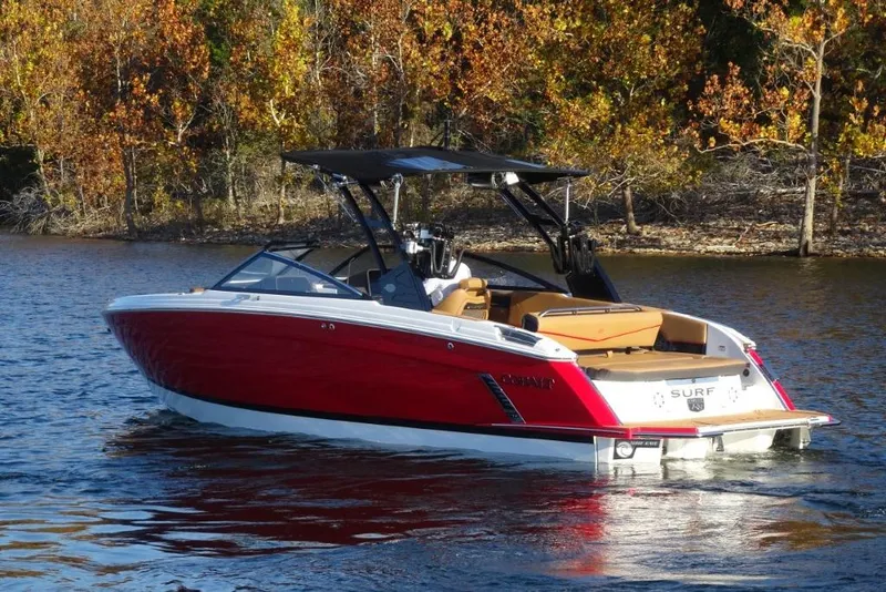 Slide: The Image of 2026 Cobalt R8 Surf boat on a lake with autumn trees in the background. - 6