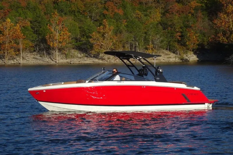 Slide: The Image of 2026 Cobalt R8 Surf boat on a lake with autumn trees in the background. - 8