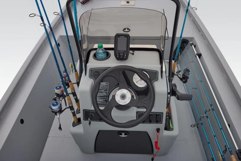 Slide: The Image of 2026 Tracker Bass Tracker Classic CC boat console with fishing rods and navigation equipment. - 11